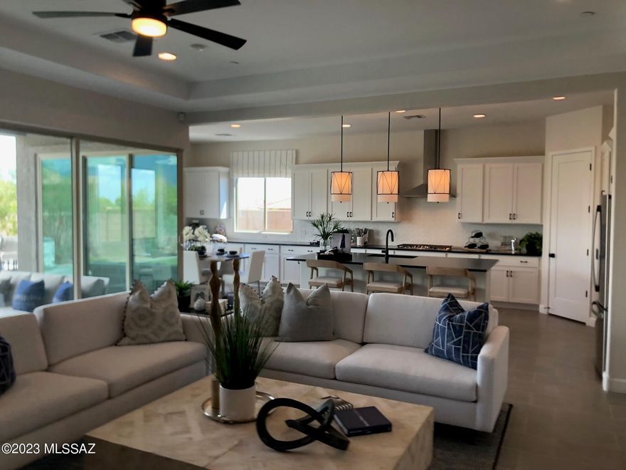 Explore this must-see Pomona model home! Included features: a central study; a spacious great room; a gourmet kitchen with white cabinets, quartz countertops, a center island, a walk-in pantry and slate appliances; a lavish owner's suite offering a walk-in closet and a deluxe bath with quartz countertops and a walk-in shower; a guest suite boasting a living area and a kitchenette; a covered patio and a convenient laundry room. This home also offers a shared bath with double sinks, a 2-car front-entry garage and a 1-car side-entry garage. This could be your dream home!