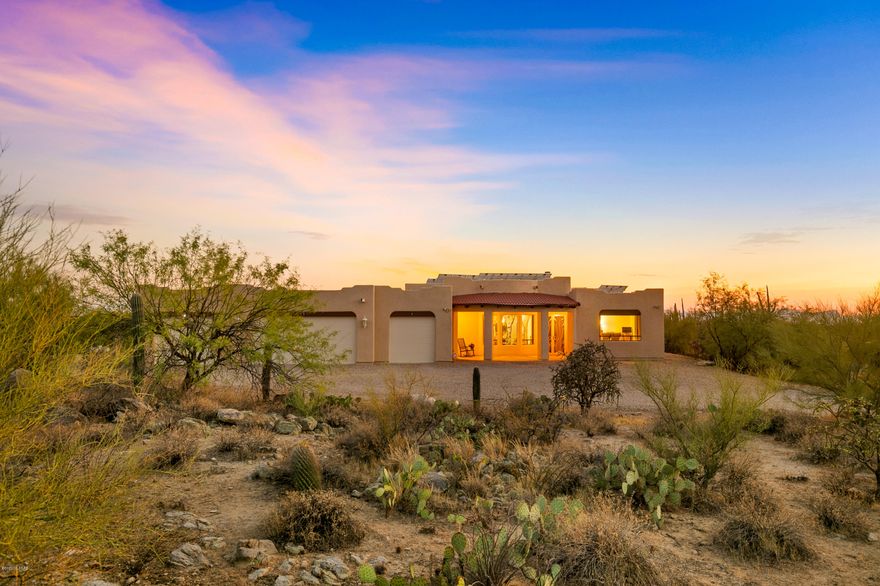 This gorgeous custom home sits on 5 acres with breathtaking panoramic view of our natural desert and beautiful rock formations!  Plenty of room for expansion, be it for an equestrian lifestyle, or adding a guest home. Two Master Suites w/access to the patio leading out to the relaxing pool.  The guest wing hosts 2 bedrooms, a second master suite & two baths. Bonus study/family room, Great room with a grand open Kitchen, formal dining and an eat in space with city views, perfect for entertaining! Gourmet Kitchen offers Granite, Island, Pantry, custom cabinetry, stainless steel, gourmet cook top. Central vacuum system makes it convenient for quick cleaning! This Home boasts tons of Green Living options, solar panels & rain water catch just to name a few. Call for your private showing.