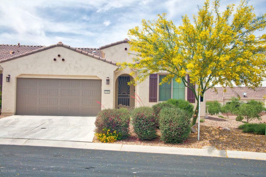 PRICE REDUCED Fall in love with this elegant Primrose villa home.  Designed for luxury living.  Impeccably kept. Stunning upgrades with a beautiful tile inlay entry. Living areas are all tile plus upgraded carpet in bedrooms. Upgraded closet cabinetry in both bedrooms providing ample storage.  Hall laundry has cabinet storage, as well. Premium Lot has wide open spaces all around plus is higher than the homes in the area. Unique Murphy bed  and extra clothing storage in large office area provides a temporary 3rd bedroom space.  Elegant Quartz countertops throughout.  Many well placed Solar tubes provide ample natural lighting.  Upgraded Stainless steel and black appliances are included.  Ready to move in.  All contents are available under separate outside contract. Priced for quick sale.