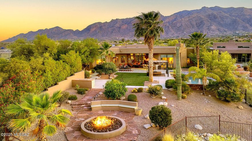 Exquisite custom home with panoramic city & mountain views and premier upgrades.  Set atop a 1.56-acre ridgetop lot, this stunning 2006 custom-built residence offers sweeping, unobstructed views of the city skyline and surrounding mountains. A brick paver driveway leads to a charming courtyard entry, opening into a dramatic foyer with soaring ceilings, expansive windows, and breathtaking vistas from nearly every room.  Inside, timeless luxury meets modern comfort. Elegant 24-inch travertine tile floors, coffered ceilings, and a gourmet chef's kitchen featuring granite countertops, stainless steel appliances, a professional-grade gas range, and solar shade screens on most windows, create a space that is both beautiful and functional. The spacious primary suite is a true retreat boasting a steam shower and high-end finishes.  Meticulously maintained and thoughtfully enhanced, this home showcases a long list of recent upgrades, including: fully owned solar system (2024) for exceptional energy efficiency; new HVAC systems (2022), dual air conditioners, furnaces, and water heaters; high-end theatre sound system in the family room for immersive entertainment; fresh exterior paint (2024) and interior paint (2025) for a modern, polished look; new carpeting (2021) in the family room, primary suite, and walk-in closet; backyard oasis remodel (2021): new landscaping, granite bar, built-in grill with stacked stone surround and LED lighting, stacked stone fireplace and spa accents, plus low-maintenance artificial turf; Enviro System Whole House Water Conditioning for superior water quality.  Located in the Catalina Foothills School District, this home offers the rare combination of refined desert living with no HOA and convenient access to premier shopping, dining, golf, and amenities. This is more than a home, it's a lifestyle. Don't miss the opportunity to own a luxurious, energy-efficient property in one of Tucson's most desirable settings.