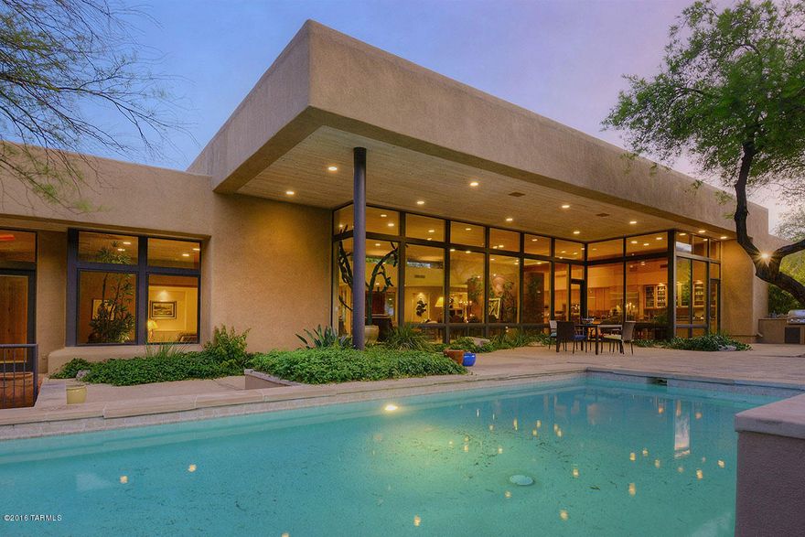 EXQUISITE & SECLUDED 1.5 ACRE SOFT CONTEMPORARY BY ARCHITECT RON ROBINETTE BORDERING THE NATIONAL FOREST IN PRESTIGIOUS GATED FINISTERRA.FROM THE MOMENT YOU ENTER,ENJOY THE INDOOR/OUTDOOR AMBIANCE OF THIS BEAUTIFUL HOME,  EXQUISITE GREATROOM W/DRAMATIC HIGH CEILINGS,ELEGANT FIREPLACE,WALLS OF FLOOR TO CEILING WINDOWS, DINING AREA, GOURMET ISLAND KIT W/GRANITE COUNTERTOPS,STAINLESS STEEL APPLIANCES, GAS STOVE TOP,SUBZERO, LOVELY BREAKFAST AREA,FLAGSTONE FLRS,  COZY MEDIA RM,4 BR'S(SPLIT PLAN) EACH W/OWN BATHS + EXEC STUDY OR LIBRARY W/EXTENSIVE BUILT IN BOOKCASES, 5 BA's, + EXERCISE OR CRAFT RM, LAUNDRY RM & 3 CAR GAR. ENJOY FAB BKYD & SERENE SETTTING W/COV'D PATIO, GORGEOUS POOL, SPA,BBQ, LUSH LANDSCAPING,3 CAR GAR,COMM TENNIS, DIST.16 SCHOOLS.FLR PLAN LOCATED UNDER PHOTOS,VIRTUAL TOUR