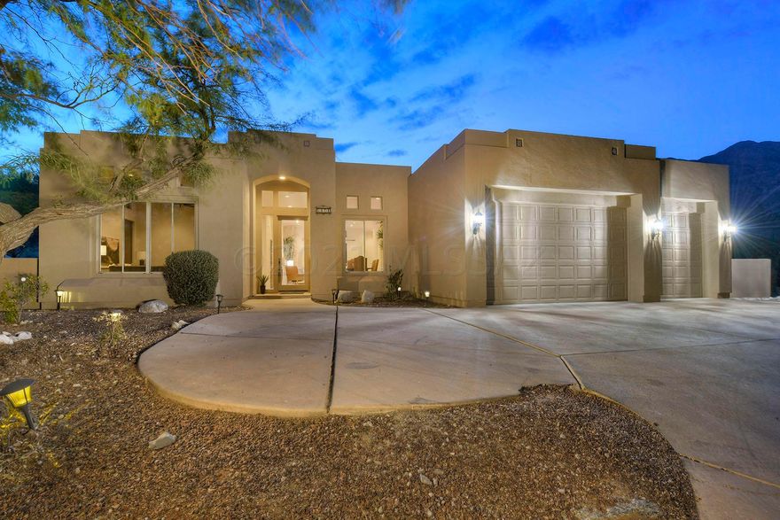 Stunning soft contemporary on top of a ridge with city & mountain views in desirable Alta Vista. Exquisite living room with high ceilings, walls of windows, formal dining area, light and open family room with fireplace, gourmet island kitchen with granite countertops, gas stove top, refrigerator,  lovely breakfast area, gorgeous tile floors, Laundry rm w/ sink, no interior steps, 4 bedrooms (split plan) and 3 baths, master with sitting area, fireplace, luxurious bath with double vanities, tile countertops, garden tub, wonderful shower, large walk in closet and private entry to the rear patio. Enjoy the serene setting of the backyard with covered patio, lush landscaping, fabulous views, 3 car garage and Dist.16 schools.