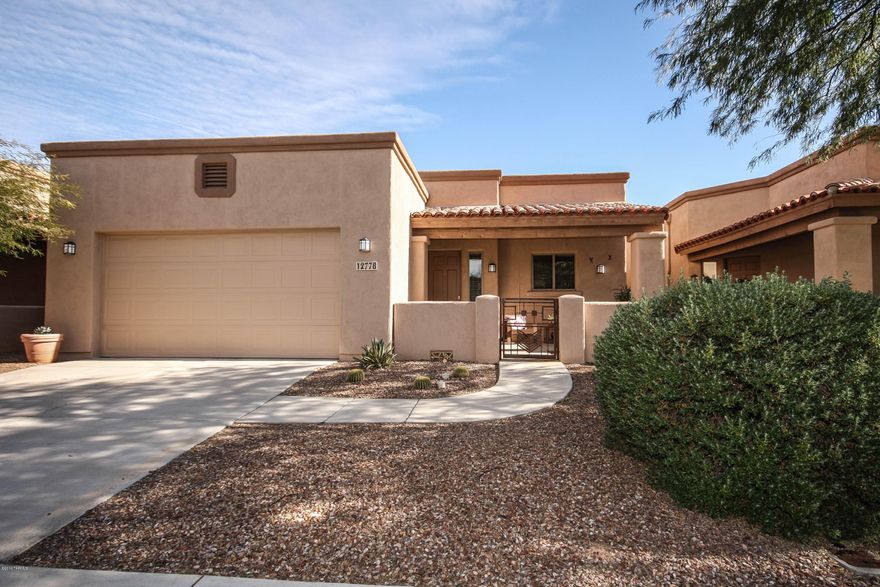 You'll love this beautiful 3 bedroom 2 bath charmer!  Split floor plan with open kitchen to the living areas in this house.  Saltillo title throughout gives this home a warm but contemporary look.  This home overlooks a landscaped low maintenance back yard larger than most in this neighborhood.  Front and back patios with ceiling fans in both.  Large master suite with a walk in closet.  This gated community is within walking distance to a grocery store, and restaurants ans shops.  Leased Solar Panels will ensure  very low utility bills .  Great energy saver!  Special Financing Incentives available on this property from SIRVA Mortgage.