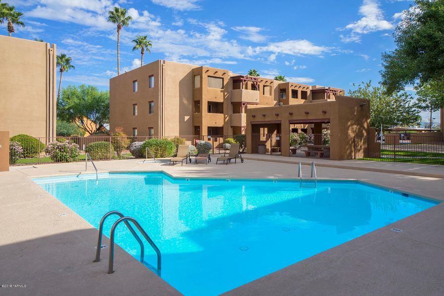A must buy! Ready to move right in!! New paint throughout, new carpet in bedrooms, new 20inch porcelain tile everywhere else. This is a great 2bd 2 ba condo in a beautifully maintained gated community. Casa Club Condos are in a prime location, Bike to U of A or UMC, walk to shopping, and great restaurants. Close to Cat Tran and bus line. Enjoy the 2 pools & spas, sand volleyball courts, shared grills and common areas. The HOA covers, trash collection, security gate, termite control, structure, roof, streets, sewer lines rooftop heating & cooling, common areas and all the great facilities. Come take a look you will not be dissappointed!