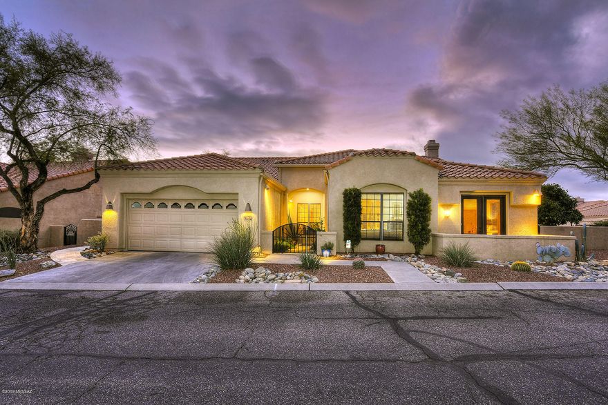 SPECTACULAR SINGLE FAMILY HOME NESTLED ON A DOUBLE LOT IN THE PRESTIGIOUS VENTANA CANYON COMMUNITY OFFERING IMPRESSIVE INTERIORS & THE FINEST OF FINISHES - PERFECT FOR THE DISCRIMINATING BUYER. LUXURY LIVING AT ITS BEST WITH RESORT STYLE BACKYARD, GAS BARBECUE, EXTENDED COVERED PATIO & MULTIPLE OUTDOOR SEATING AREAS. THIS 2867SF HOME OFFERS A SPLIT BEDROOM FLOOR PLAN - IDEAL FOR VISITING FAMILY & FRIENDS - THREE BEDROOMS ALL W/PRIVATE ENSUITES, SPACIOUS LIVING & DINING AREAS, FAMILY ROOM W/SOARING CEILINGS, GAS FIREPLACE & HUGE WINDOWS W/SANTA CATALINA MOUNTAIN VIEWS. GOURMET KITCHEN OFFERS GRANITE COUNTERTOPS & SUB-ZERO REFRIGERATOR W/GLASS DOORS. NATURAL STONE TRAVERTINE FLOORS, SOLID KNOTTY ALDER WOOD DOORS, NO INTERIOR STEPS, 24 HOUR GUARD GATED COMMUNITY. TRULY A REMARKABLE RESIDENCE.