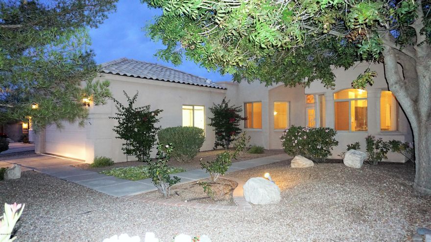 MUST SEE RECENT REMODEL! Gorgeous Granite Slabs in Kitchen & Two Bathrooms! Lush green setting, w/ abundantly landscaped yards front & rear. Yard lighting, Waterfall, mature trees, & blooming plants. Mountain views & Spa pad with electric awaits relaxing soaks in your future spa. Quality masonry/metal frame construction. Stunning plank flooring, soaring ceilings, Great Room, 3 Bedrooms + Home Office/Den. Sunny Kitchen w/ charming Breakfast Bay. 16 SEER HVAC approx 4 years new. Stainless Refrigerator & Gas Range with Upper and Lower Ovens. Both Bathrooms feature Double Sinks & Granite Slab Countertops. Step through double doors to your Master Oasis w/ space for sitting, & private French door to the Paver Patio w/ Pergola. Master Bath features Separate Shower, Garden Tub, 2 closets, Linen. Former Model Home has additional recessed lighting, 2 windows, and shop lights in Garage. Additional privacy with no home behind.Full size truck fits in extra long garage/drive. Alarm System. Whole House Surge Protection. Cable chases in Master and Great Room for Surround Sound and TV setup. All Appliances stay.  Exceptional Vail Schools!