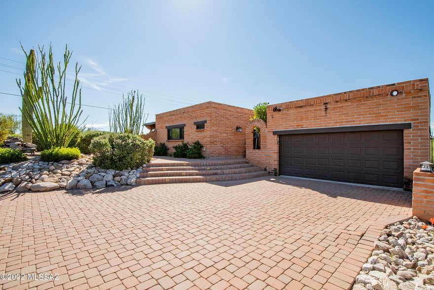 Range priced $845k-$865k -- Views, Views, Views from the highest lot in the neighborhood!  City lights, mountain and sunset views are sure to wow you!  From your perch you can gaze out to downtown Tucson, U of A stadium, A-Mountain and even Kitt Peak all from the kitchen, dining, family room and BBQ deck.  This foothills charmer was originally built in 1977 but underwent a large remodel in 2017 which adjusted its effective build date to 1987.  Bonus to you!!  It's an easy flowing floor plan with 2,539 square feet, 3 bedrooms, 2 1/2 baths, TV / Living Room with Fireplace and Dining Area.  The updated kitchen offers soft close cabinetry and drawers, pull out shelving, large island with power, shelving and bar seating for 3, new beverage fridge and wine fridge and induction cooktop....Cont... Newer Anderson windows throughout. There are two separate patios with a pass through pet area - one is on the south side of the house with built in BBQ grill, wood burning fireplace, al fresco dining and outdoor TV.  The second patio is on the east side of the house and provides a covered patio, outdoor TV, water fountain, pebble tec pool that goes to 8' in depth and has great shade during the afternoons on those hot summer days plus solar coils to extend that swim season.  The 2 car garage is heated and cooled and also provides two separate storage rooms and the whole house water softener. New HVAC system, water heater and PVC irrigation installed in 2021.  Low HOA Agent / Owner