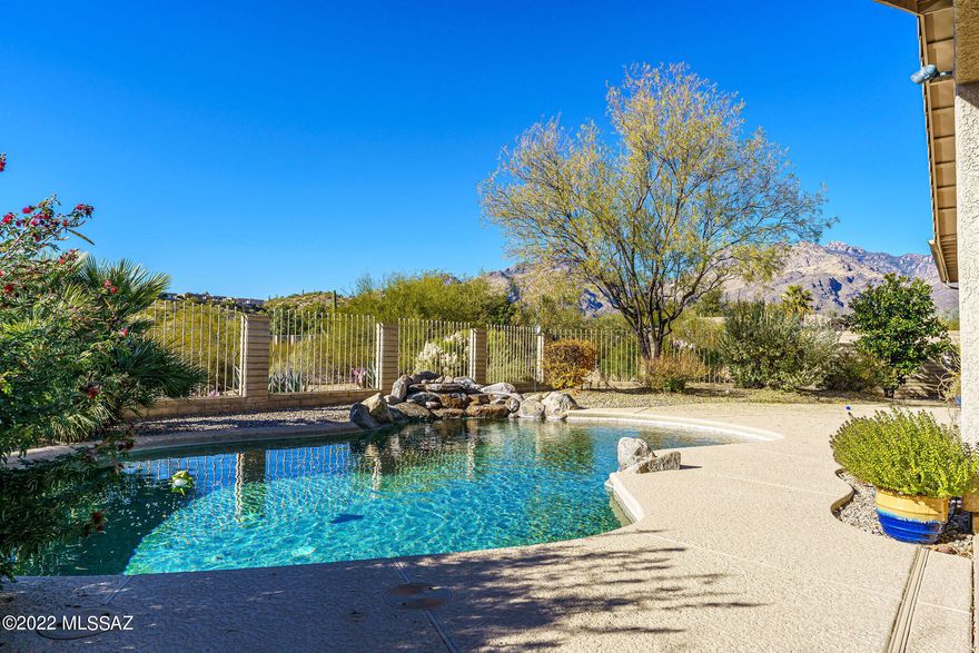 IMAGINE... 4 bedrooms. IMAGINE.an art studio or sewing room with all the storage you need.  IMAGINE Sabino Canyon being close enough for regular hikes.  IMAGINE a beautiful pool with gorgeous views and a covered patio large enough for a crowd.  IMAGINE fruit trees of many varieties with a newer drip system throughout the yard. IMAGINE a fully paid for solar system!  Soft water and a kitchen water filtration system.  Fireplace is beehive shape with electric insert. This lovingly cared for home offers buyers the ability to move in any day and be able to just sit back and enjoy.  This can be your next dream home!  IMAGINING makes things HAPPEN!