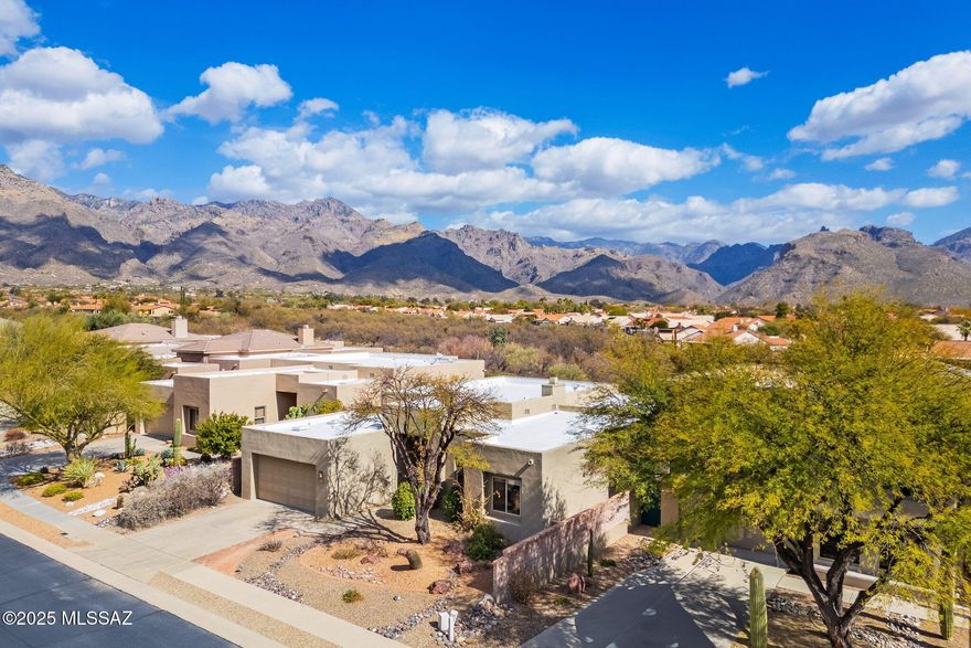 Nestled in the gated & highly sought-after Fairfield built Bonita Ridge neighborhood. Exquisite 2,543 sq ft contemporary home offers the perfect blend of luxury & tranquility. High ceilings & thoughtfully designed built-ins throughout home enhance its expansive 2 bedrooms and 2 & ½ baths. The 3rd 'bedroom' can be office or den & offers amazing flexibility. Large chef's kitchen seamlessly flows into dining & living areas, where a wall of windows frame breathtaking, unobstructed mountain views to the east & surrounding washes. Spacious primary suite features a walk-in closet & a good size second closet + enormous ensuite with separate tub & shower. Step outside to your own private, fully landscaped backyard oasis. Enjoy nature from the large-covered patio, perfect for entertaining or relaxing in total privacy thanks to the surrounding wash. This stunning Foothills home is close to recreation, shopping & dining. District 16 schools. Welcome Home!!
