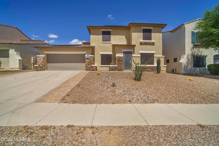 Whether you are looking for a home to relax and unwind after a long day, or a home to entertain friends and family, this beauty has it all! Perfectly located in the heart of the award winning community of Rancho Sahuarita, this home is surrounded by walking trails, parks and the privacy of no direct rear neighbors! The 10ft custom kitchen island and extra storage provides the perfect space for hosting any gathering while the fully screened patio will guide to ultimate relaxation in your peaceful, fully landscaped, backyard... unwind in your steam sauna while the fire crackles and the smell of delicious burgers from your outdoor kitchen ignites your senses.
Enhanced storage, built-ins and custom closet spaces provide ample areas for organizing your home. With an air conditioned three car tandem garage you will find housing for all your cars and/or toys! Two additional flex spaces at the front of the home offer a variety of options, from home office space, gym space, kids play space to homeschool space... the possibilities are endless! This home built by Pulte is complete with leased solar panels to keep those summer cooling costs to a minimum...you truly couldn't ask for more! Welcome Home!!