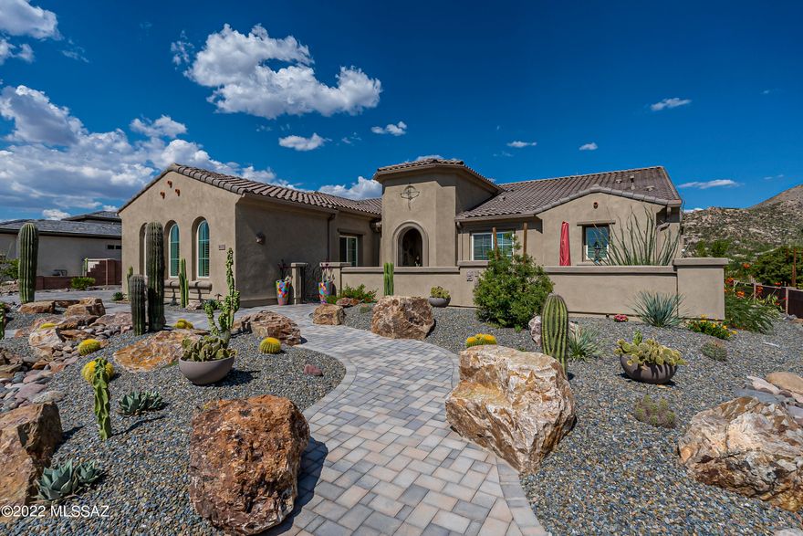 Upon entering this Sonrisa model @ Saddlebrooke's Preserve, attention to detail is obvious. The home features porcelain tile throughout.  White cabinets in kitchen featuring glass doors, shelving & interior lighting. Quartz counter tops & oversized kitchen island w/waterfall edge & storage. There is a walk-in pantry/wine cellar & butler pantry. Appliances are high end Stainless Steel. Great room slider to glass-enclosed patio showcasing view & fireplace wall wired for a flat screen. Split plan design w/guest area & baths opposite master. Master his/her walk-in closets w/built-ins & master bath w/oversized walk-in shower & separate vanities. The den has multiple built-ins for library-style storage. Did I forget the unobstructed & unchangeable view w/golf course to mountains? Its panoramic!
