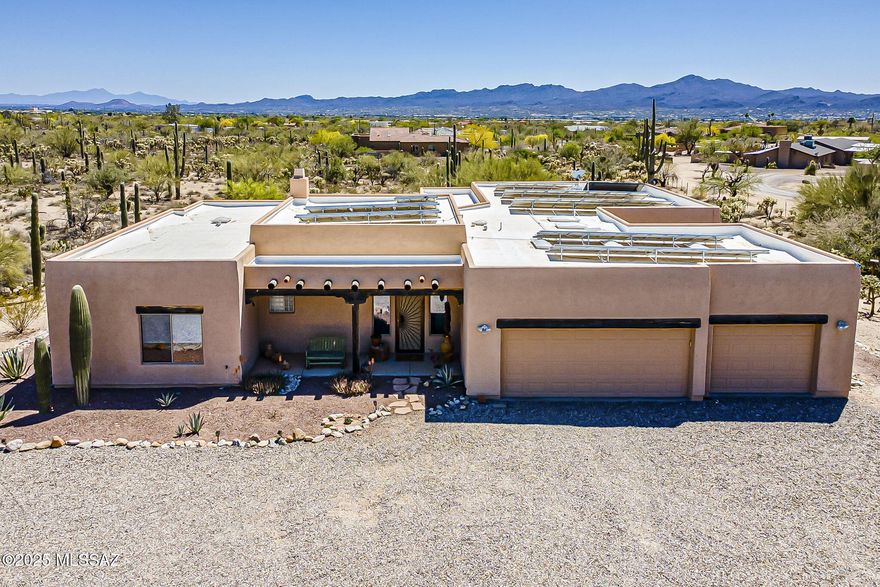 Custom Sante Fe-Style Retreat on 3.31 Acres with Mountain Views. Welcome to your private desert sanctuary! Nestled on 3.31 sprawling acres, this beautifully maintained Santa Fe-style home offers serene living with captivating mountain views and southwestern charm throughout. Step inside to discover a desirable split level floor plan, perfect for privacy and functionality. The inviting living space features a cozy bee hive fireplace, ideal for cool desert evenings, opens up to a wood-beamed back patio-a perfect spot to unwind or entertain while taking in the stunning vistas. Enjoy peace of mind and energy savings with owned solar panels, a new A/C installed in 2023, and a flat roof re-coated in 2022. The home's exterior freshly painted 2020, adding to its well-kept appeal. A long private driveway with brand-new gravel welcomes you home, offering seclusion and a grand entrance. With authentic finishes and thoughtful upgrades, this home truly blends comfort, efficiency, and timeless desert style. Don't miss your chance to own this desert gem!