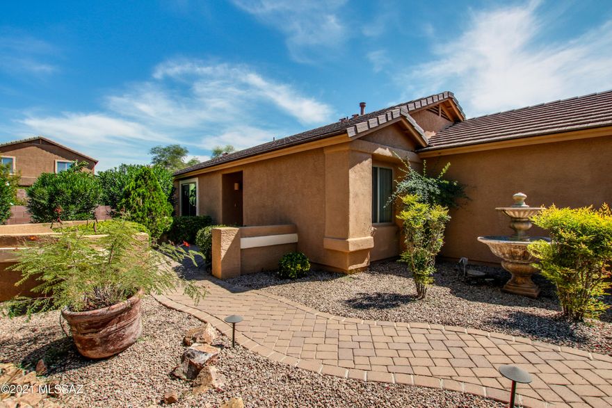 Former model home. All the options are here. Landscaped front and back yards. 3BR+den. Newly painted inside and out, new flooring throughout with custom epoxy garage.  Home includes upgraded light fixtures, two tone paint, and mirrored doors in the bedrooms