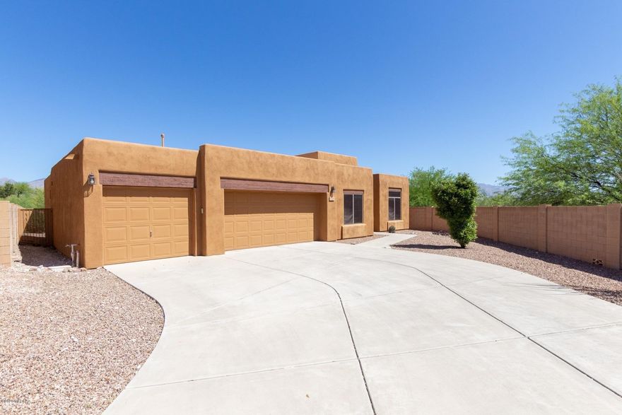 Welcome to Palomino Trail! A handsome Pepper Viner community on Tucson's popular NE side! Premium lot at the end of a cul-de-sac with mountain views and conventional spa! One of the best lots in the subdivision! Backs to open space and offers a very  private back yard setting. Oversized 3 + car garage with storage and workspace area. Great garage for a handy person or someone with a hobby. Could even work as an indoor gym area. 3 br 2.5 baths plus den or office. Split bedroom plan. Family room off kitchen with a gas fireplace plus a separate living area and formal dining area. Kitchen has a breakfast bar and built in desk. Ceramic tile throughout (no carpet) Great opportunity!