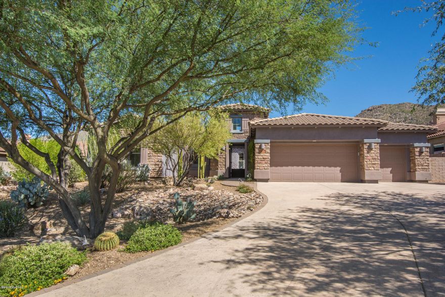Gorgeous, highly upgraded Toll Brothers home in gated Solana at Dove Mountain. Beautiful gated front garden-style front courtyard and an even more stunning backyard that hosts a beautiful pool w/gas firewall, outdoor ramada w/kitchen.  Custom office w/alder shelves + hardwood floors. Gourmet chef's kitchen highlights Viking double oven and  Subzero refrigerator, Miele wine refrigerator + a gorgeous granite island breakfast bar. Great generational wing dual bedrooms w/own bathrooms and large bonus/family room. Finishes in this home are beautiful. From the private, peaceful front courtyard to the oasis resort style backyard, this home has much to offer in privacy and/or family gathering living.  Call for private showing.