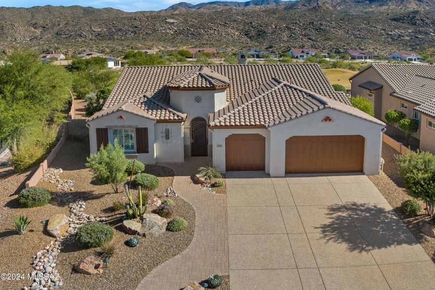 2016 Paloma located on Corner Lot with Golf Course & Mountain Views in the Preserve. Paver Pathway & Gated Entry. Great Room with Gas Fireplace & Bar Area with Wine Fridge. Open Concept Living. Kitchen has Stainless Steel Appliances, Induction Cooktop, Granite Counters, Cafe Matte Cabinets with pull outs, Large Island, Butler Pantry & Walk-in Pantry. Dining Area with Slider to Patio. Serene Owner's Suite has Ensuite Bathroom with Quartz Counters, Walk-in Shower & 2 Walk-in Closets. Powder Room & Extended Den/Office. Guest Bedroom offers Walk-in Closet & Ensuite Bathroom with Walk-in Shower. Laundry Room has W/D, Sink & Cabinets. Extended 3 Car Garage. House exterior painted 7/2024. Covered Paver Patio with Electric Rolling Shade & extended Patio to enjoy stunning views everyday!