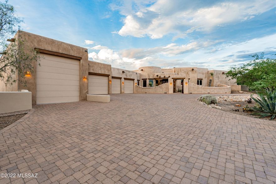 This is an exquisite example of a ''Ray Birch'' home. Birch Construction homes are known for their quality, architecture & capturing the essence of Tucson. Solar is free & clear, electricity bills next to nothing. Pool & spa are connected to both solar & propane gas you can choose which to use. Latillas with vigas, saguaro ribs, cove ceilings, decorative tiles in the bathrooms & kitchen, 3 coat imperial stucco inside, 3 coat stucco system on the outside. A cooks dream kitchen, spacious & elegant. Open plan concept, high ceilings. Master shower to party in! Built-in entertainment center with beehive fireplace for those cool nights. Retreat style living!
Large, welcoming, entry gate. Guest quarters with separate entrance, patio. Relax in pool with many water features, jets for swimming against a current. Incredible views from anywhere you look, inside or out. RV garage convenient for a 40 ft long camper. Plenty of parking outside too on the circular paved driveway, storage throughout the home, large storage room in garage also. No horse facilities but horses are allowed.