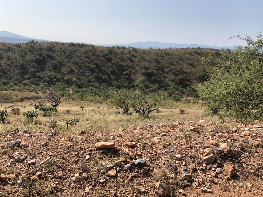 Great 36 acre parcel of land at the end of Lado de Loma Dr.  Great views of the mountains, lights of Nogales and very private.  Backs to private ranch land.  This is a very great building site for a custom home.   Sunrise and sunset views every day plus watch the storms come in off the mountains.  Close to historic Patagonia and 20 minutes from Nogales,and 30 minutes from Sonoita wineries.   Patagonia, Az is marketing address. Mailing address is Nogales, Az