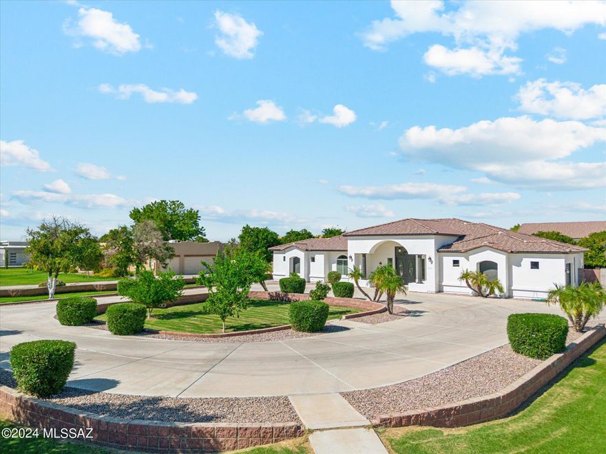 Your own ''Back Forty'' includes a traditionally classic 3600+ Sq.Ft., 5 bd., 3.5 ba., 3 car attached garage home, plus an AMAZING  3,500+ Sq.Ft., detached shop with 740+ sq.ft. apartment (casita), 3 overhead doors and interior space that are both ample size for a large RV, and a full auto collection.  3 dozen mature fruit trees.  Classy concrete circular guest arrival driveway, plus concrete and gated driveway to rear property (SHOP) and concrete exterior parking for dozens more vehicles, trailers, projects and storage.  Location is quietly hidden in plain site from the crowd, but still in the heart of the town's best conveniences.  A major challenge to find another available home with 1.5 acres and established full scale shop, let alone in this condition and location.
