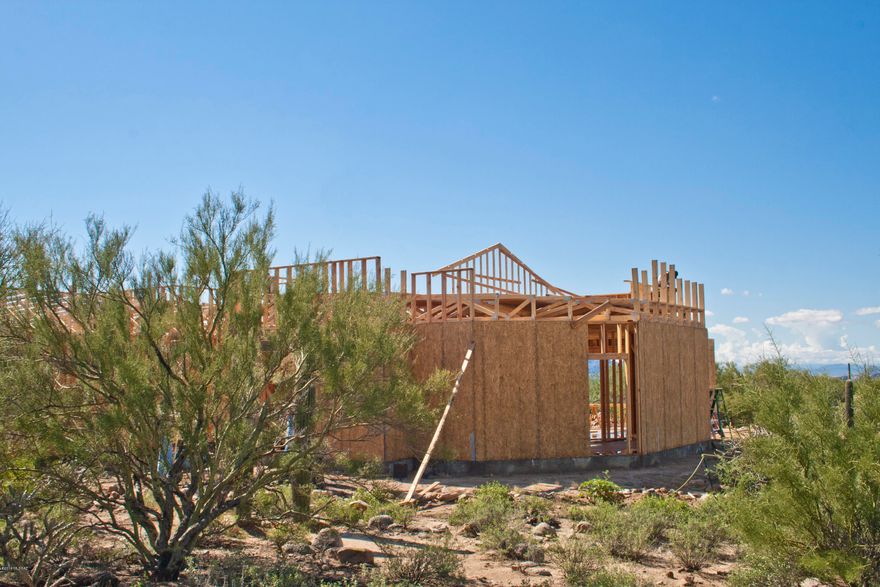 You've found VALUE at its finest in the gated community of The Estates at Tortolita Preserve with this 2,756 square foot design. John Herder delivers QUALITY construction and includes upgrades as standard! Featuring an open layout with a spacious great room off of the kitchen and a split bedroom design. Enjoy multiple covered patios, a 4-car garage, and a very large 2.51 acre lot that delivers views & privacy. The flexible design includes a 4th bedroom or use it as a den or dining. This community's location is ideal for those seeking an active lifestyle with nearby hiking/biking trails, off road vehicle access, and exceptional golf. Customize this spec that is under construction OR choose from other available lots & build your own dream home! View the 3D Walkthrough Tour under Photos Tab.