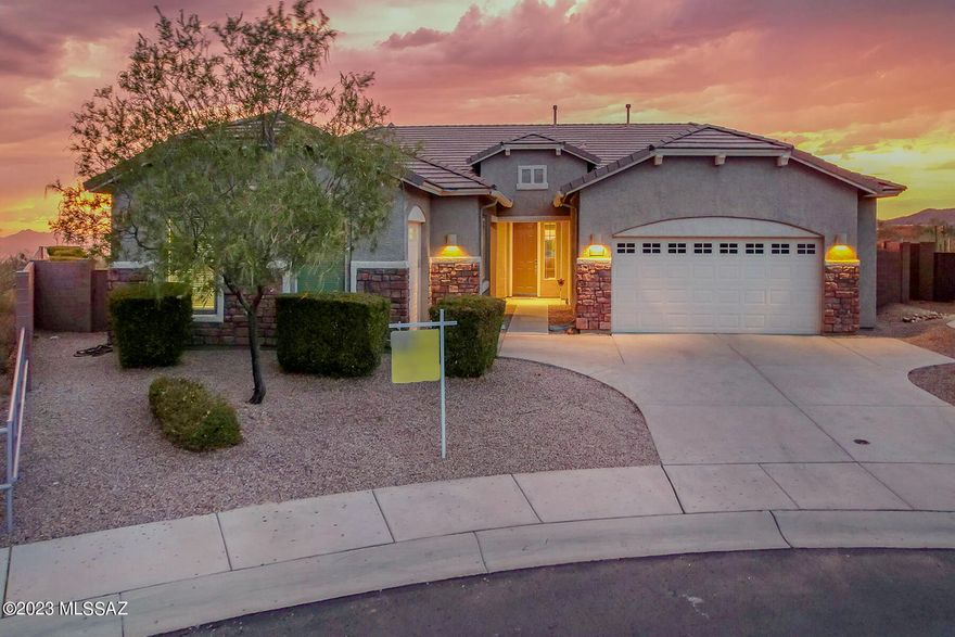 This is the lifestyle you deserve. Views in every direction. Twinkling city lights and mountain views surround this end of cul-de-sac Dove Mountain Home. Another fantastic feature is a private Mother-in-law suite with living room, bedroom, kitchen, laundry, garage, and private entry. The main house and guest facility have many upgrades. The main house has three bedrooms two full bath, plus an office. Both kitchens have granite counter tops and upgraded appliances. The master bedroom has a large walk-in closet, dual sinks in the bath with separate shower and tub. The back yard has a covered patio, view fencing and beautiful pool. Look in the documents section of the MLS to see the floor plan, maps, and enviro whole house water system and more.