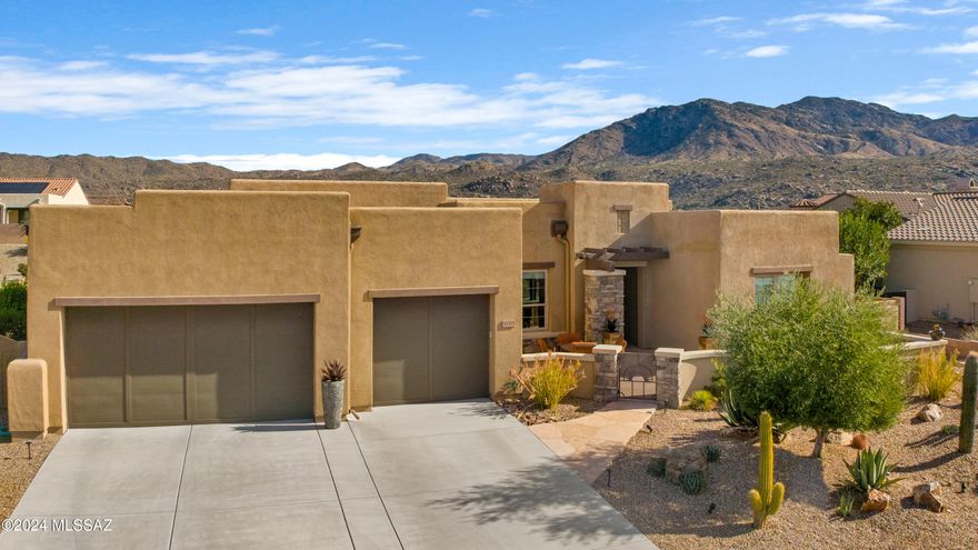 Best Value!! You won't find a better house at this price in The Preserve.  
East facing back patio with mountain views. This customized home offers 2 bedrooms suites,  a den with double doors and a bonus room ideal for a studio, hobby room or additional guest space. This Canyon plan features an open great room with 12 Ft ceiling, a built-in entertainment system with surround sound and views of the Catalina Mts. A warm inviting interior includes 8 Ft Alder wood doors that coordinate with matching trim & baseboards throughout. Ceramic tile floors, quartz counters and Hunter Douglas shades. Remote sun screens on 6 sets of windows. Enjoy outdoor living on the extended paver patio with gas BBQ and gas fire table. Additional features include:

Custom designed built-in Alder wood entertainment cabinet in great room with 7 speakers for surround sound.
Custom designed entry wood wall art with back lighting.
Remote controlled retractable exterior "sun shades" on 6 sets of windows
Central Vacuum, water softener and whole house surge protector
4 Ft. extension on guest bedroom
Pass through door to hall from owner suite walk-in closet
Home security: hard-wired with 2 keypads
Water fountains in front courtyard and on back patio
Built-in Napoleon gas barbecue with custom serving counter
Fire table on back patio is attached to natural gas line
Deep fully fenced backyard with retaining wall as a raised planter
5 citrus trees and a variety of cacti
Front courtyard offers views of the Catalina Mountains.
Plenty of space to add a pool in the back yard with double wide gate at the side for easy access.