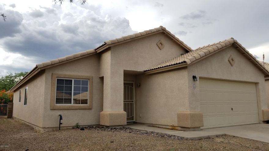 Bright and roomy 3 BD/2BA home with tall vaulted ceilings in northwest Tucson tucked into a lovely small neighborhood and ready for move in! Entry opens up to the spacious living room and formal dining. Kitchen features plenty of storage with a center island and breakfast bar overlooking the dining area. Master suite has a private bathroom and huge walk-in closet. Home also has 2 guest bedrooms, guest bathroom with shower/tub, large laundry room, and 2 car garage. Backyard is beautifully hardscaped for minimal maintenance and all rear wall for privacy.