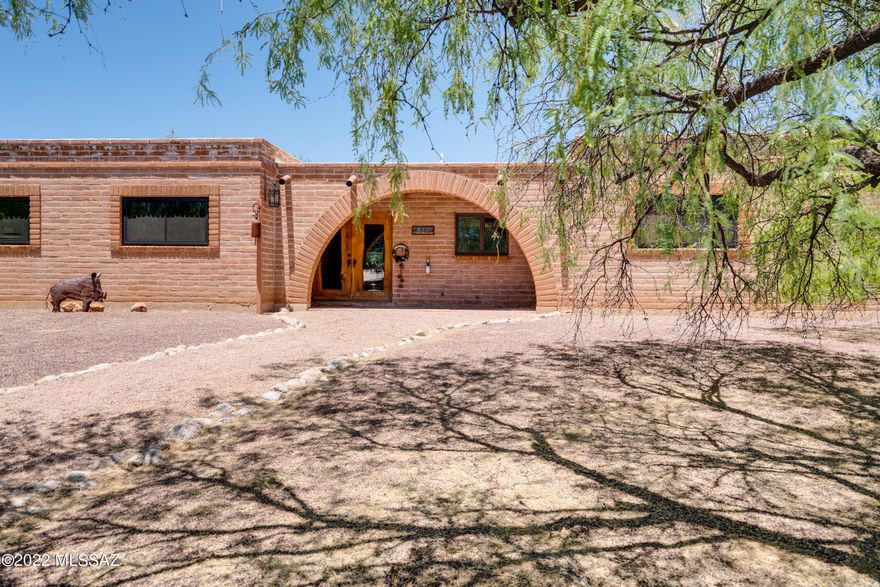 Curb appeal is an understatement. Absolutely stunning one-of-a-kind Sabino Vista beauty. 5 bed and 2 1/2 bath with tons of upgrades. Gorgeous travertine tile throughout main living areas, carpet in bedrooms. Updated kitchen with new appliances. Large laundry room with 1/2 bath. Wall of French doors in Family Room, Living Room and Master Bedroom open up to the full length covered patio for all of your entertaining needs. Patio overlooks the most spectacular swimming pool where you will be tempted to cool off from the hot AZ summer! Abundance of fruit trees and shade trees along with raised flower and vegetable garden beds throughout the back yard. Long driveway with 2 car garage. Do not miss this truly unique home!