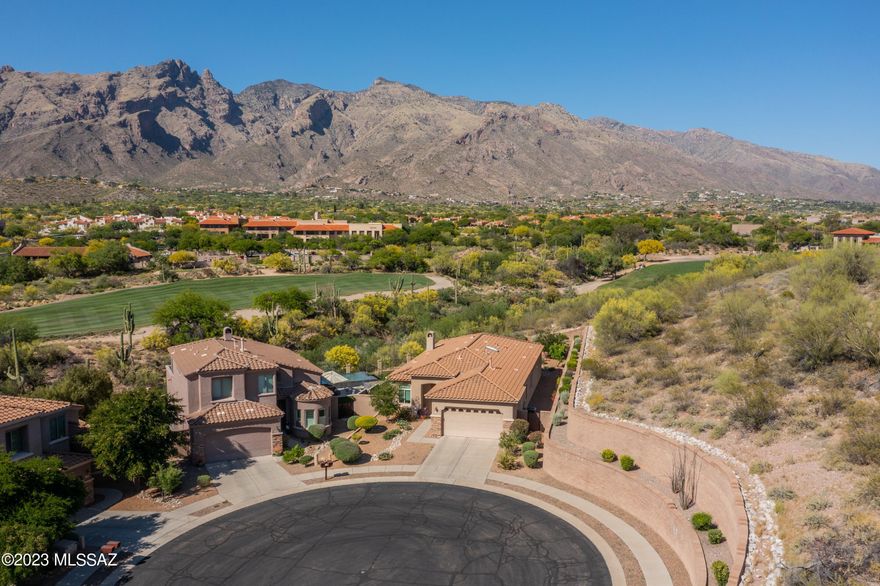 Views! Views! Views! Perfectly located within the Villages at La Paloma, this well-appointed 3 bedroom/ 3 bathroom homes sits on a cul de sac lot with stunning unobstructed panoramic views of the Catalina Mountains and Finger Rock. This home borders common area which provides added privacy. Chef's kitchen with ample cabinetry and counter space plus center island. Light and bright breakfast nook. Great room with cozy gas fireplace and built in shelving. Inviting dining area with custom artistic window. Spacious primary bedroom with updated ensuite bathroom and large walk-in closet. 2 generous guest bedrooms, guest bathroom plus powder room. This home is truly move in ready! All windows were replaced in 2020. HVAC was replaced 2020. Don't miss this home!