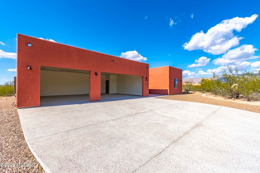 You'll absolutely love this New Sante Fe Style home located on almost an acre !! This Gorgeous house will stun you with its modern and dazzling interior finishes. This home offers spacious interior, generous sized rooms, amazing design flow, astonishing polished concrete floors & high ceilings throughout!! The Open Kitchen Boasts of Beautiful Custom Knotty Alder Cabinets, Granite Counter tops, a Massive Kitchen Island & Stainless Steel appliances to be installed. Great Room Concept w/ Living Room and Dining Area off Kitchen. Hall Bath w/ Granite Countertops and custom tile surround bath. Enormous Owner's suite. Owner's suite Bath w/ dual sinks, custom bath area & Luxurious custom walk-in shower. Split bedroom floorplan! Huge Backyard w/ covered patio!!! This lovely home is Suburban living at its finest!! You are buying a lifestyle not just a home!. Come See your new home today!