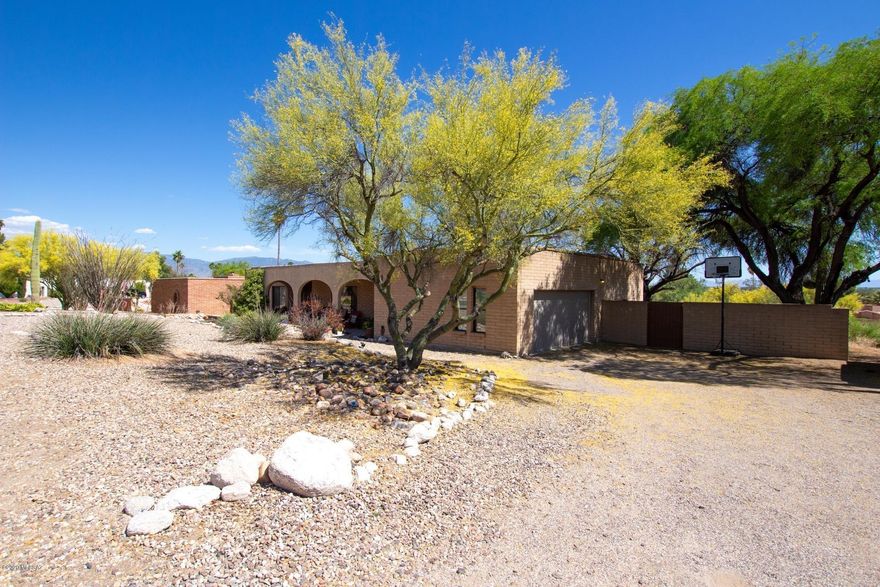 Beautifully maintained family home in Sabino Vista Knolls. Home sits on a half acre lot with a multi-tiered backyard and a Pebble Tec pool. Updated wood flooring throughout the home, updated bathrooms and kitchen with stainless steel appliances. A/C is about 4 years old. Guest bedroom with separate bathroom on opposite side of home. Master bedroom boasts his and hers closets. This home has amazing mountain and city views. Owner is licensed agent.