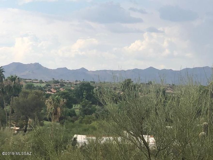 Range Pricing 780,000-925000.  This incredible lot is ready to build on. Located on a flat elevated lot to allow for mountain and golf course views. Located in Tucson National which is a prime location. Close to schools, shopping, Malls, Hospitals. All utilities are to the lot line. Easy lot to build on. Many new homes are being built in the subdivision. Plans are available for a 3200 sq. ft 4 bed, 3 bath home with a 4 car garage. All Block construction in this subdivision.