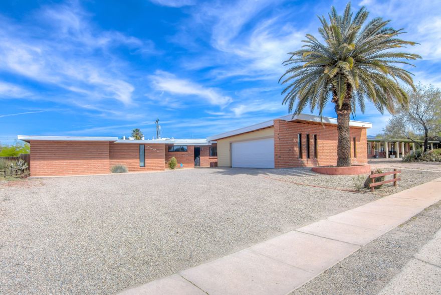 Mid-Century Classic Burnt Adobe 4 Bedroom 3 Bath With A Recently Built (Permitted) Large 2 Car Garage. Huge Backyard with Swimming Pool. This Home Still Has All Of Original Classic Features But Has Been Lovingly Maintained To Be Move In Ready. Newer Floors Throughout The Entire House. 2 Fireplaces To Relax By.