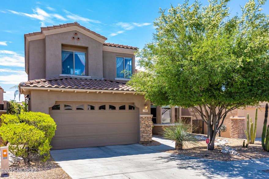 Absolutely exception, updated home with mountain and golf course views! Elegant great room with soaring vaulted ceilings, great entertaining space that flows easily to the back patio for effortless indoor/outdoor living with built in outdoor kitchen, Banco seating, Chiminea fireplace and Hot Tub.  Gourmet kitchen has granite counters and stainless appliances, under-counter lighting, large pantry and dining area . Owners Suite  on main floor with large walk in closet opens to back patio & features a spa like bath with jetted tub and custom closet.  Upstairs are two additional bedrooms as well as an office/den (potentially a 4th Bedroom) Garage has plenty of extra storage space with built in cabinets. Villages of La Paloma golf community offers a manned gate, pool, spa and fitness facilities