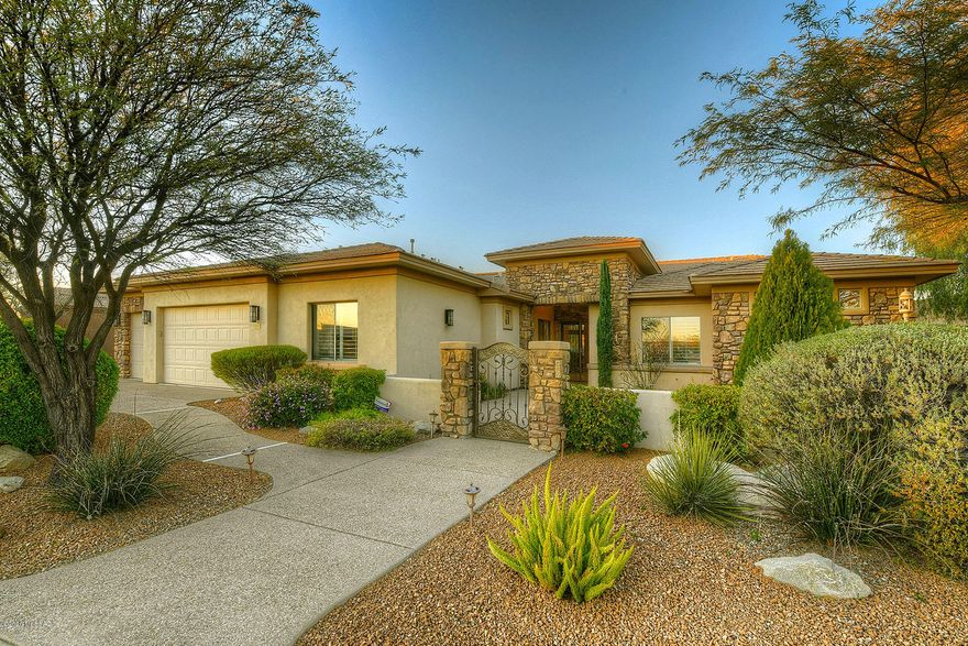 Gorgeous custom well maintained home w/in the gated community, Vistoso Highlands, of Rancho Vistoso. Enter through your private brick courtyard into the beautifully appointed interiors. Great room design offers open living/dining space w/ floor to ceiling windows & a cozy stone fireplace. Split floor plan featuring 4056 sq. ft, 4 bedrooms plus office, & 3.5 baths. Extensive & detailed rock work throughout the home adds to the unique & custom feel of the home. 3 fireplaces (great room, living room, & master suite) make you feel right at home. Premium kitchen appliances w/ a gourmet Miele Built-in Coffee maker. 3 car garage. Enjoy stunning mountain views from your resort style backyard. Includes built in kitchen, & extensive covered patio. Luxurious Pool/Spa are all awaiting you!