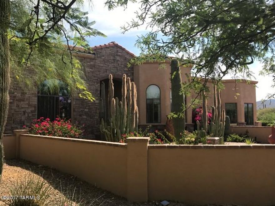 Attention paid to detail in this custom 100% solar supplied home on over 3 acres of pristine desert with incredible mountain views. Open floor plan concept and natural light 5 BR & 5 baths, updated kitchen, split floor plan, separate guest room with independently HVAC. Guest quarters with bath, tankless instant on hot water heater, 4 car garage. Quality hardwood flooring, Spacious and light with large picture windows and many skylights, large master suite with remote control window coverings and beautiful master bath. Custom window coverings and energy efficient LED lighting, wrap around rear and side patio with tile floors, outdoor kitchen, luxury pool with slide and outdoor shower, landscaped grounds and fenced backyard.