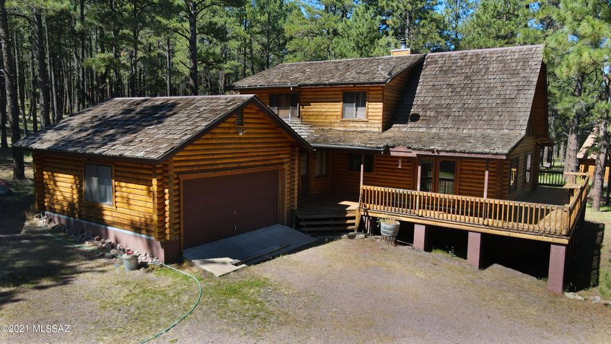 THE PREMIERE ALPINE RANCH - 32+ acre Horse Ranch across from Luna Lake. 3 bedroom & 2 bath log cabin with attached garage/mud room, 2 bedroom & 1 bath guest cabin, 2 story oversized garage with loft. (6) stall mare motel horse barn with heated wash rack. Buildings are nestled in the tall pines overlooking a huge meadow with Luna Lake in the backdrop. Elk frequently bed down and roam the property. Private well and septic or you may hook up to the Alpine Sanitary District for public water and sewer. All buildings have recently been hand oiled. Pre-Qual/POF required to view the property.