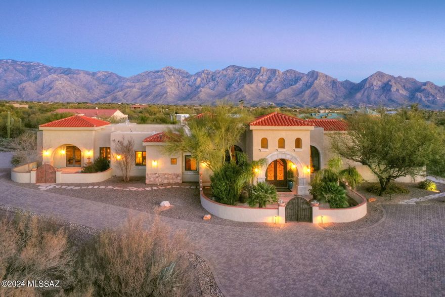 THIS IS AN ABSOLUTELY AMAZING PROPERTY! MAGNIFICENT MEDITERRANEAN STYLE 6 BEDROOMS/ 4.5 BATHS PLUS GUEST CASITA/BATH & OFFICE SITS ON A 3.4 ACRE LOT WITH LOVELY MOUNTAIN VIEWS. HOME BOASTS AN INCREDIBLE BRICK BOVEDA CEILING & CUSTOM DESIGNED MARBLE MEDALION IN MAIN ENTRY FOYER, SOLID ALDER WOOD DOORS & CABINETRY, NUTONE CENTRAL VAC & INTERCOM SYSTEM, 18 MEXICAN CARVED CANTERA STONE COLUMNS, LOWEN & WINDSOR WINDOWS, FABULOUS CHEF'S KITCHEN W/ BUTLER'S PANTRY, SPACIOUS ENTERTAINMENT ROOM W/ 2 WAY FIREPLACE & BUILT-IN BAR PLUS AN INTERIOR COURTYARD W/ CANTERA FOUNTAIN. ATTACHED CASITA W/ OFFICE HAS ITS OWN ENTRANCE & MAKES A PERFECT SEPARATE GUEST SUITE. EAST FACING OASIS LIKE BACK YARD HAS A PRIVATE VIEWING DECK, MATURE FRUIT TREES, PUTTING GREEN, CUSTOM FIRE PIT & DELUXE POOL & SPA!