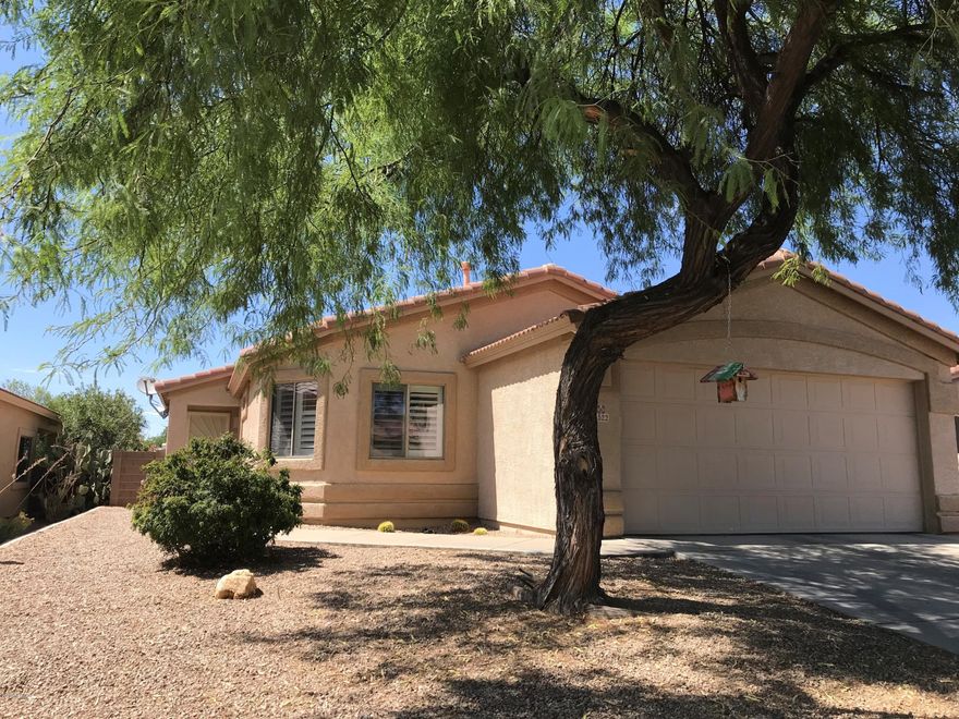 Charming, immaculate, and well appointed home with beautiful backyard in Dove Mountain.  Owners have updated the home inside and out and it shows like a model home.  Open floor plan. Beautiful and spacious kitchen with stainless steel appliances , lots of cabinet space, gorgeous back-splash, and under-cabinet lighting. Tile floors throughout. Plantation shutters on most windows. Large master bathroom with double vanities. This property is move in ready and truly a gem.