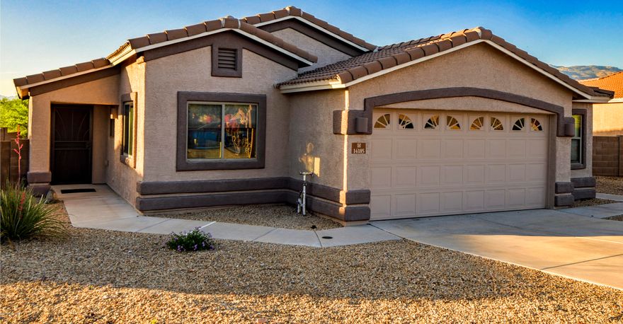 VAIL SCHOOL DIST. Tucson Taxes! Wow this charming house offers some very BIG views of the Rincon Mountain Range! The home sits on a end lot that backs to a common area for a real sense of privacy! Large wrap around back yard has plenty of space for cook outs, pets, and more! The inside of the home has wonderful upgraded ceramic tile floors throughout with new carpeting in the two extra bedrooms. Large working kitchen that is open to the dining area and living area. (Seller just installed a new brushed nickel kit. faucet and upgraded to new garbage disposal) The master bedroom is large and has great views of the mountains, nice size master bath with a spacious garden tub! There is lots of storage in the 2 plus car garage with a window. This home is just right for a couple or small family! lower tax basis! TV in living room does not convey, but TV mounts will stay in living room and two of the bedrooms. New exterior paint 2 years ago, title roof, termite and bee. Vail school busing. Walk, hike, bike, horse back to Sahuaro National Park East, just minutes away!  New Safeway just opened minutes from the house.
