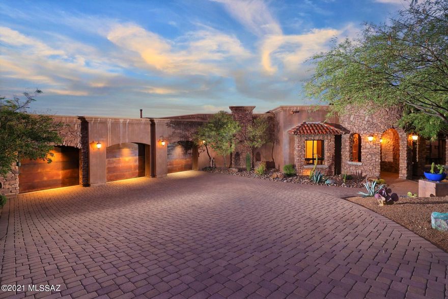 LOCATION, LOCATION, LOCATION. Nowhere else in Tucson can you find the convenient relaxing resort living, panoramic city and mountain views in a world class environmental master plan than Starr Pass surrounded by the Tucson Mountain Park. YET minutes away from Downtown vitality, Raytheon, Caterpillar, Amazon, UArizona, Pima College West, Hospitals and all necessary conveniences.  This FANTASTIC home is nestled right next to 100's of acres, where one can enjoy bird watching, animal migration, dark sparkling skies and of course twinkling lights of Tucson. Property includes membership initiation fee for highest priced JW Marriott Starr Pass Resort and Spa membership.  This is a hikers, bikers, birders, star glazers paradise.    Enter the home through massive doors to the foyer & entertainment room with grand doors to the large covered patio and negative edge pool and spa. Followed by a wonderfully designed with wooden cabinets and top upgraded kitchen and great room with dining and bar! Three bedrooms all with on-suite baths and forth bedroom converted to office and 350 bottle wine cellar. There are so many things to admire, solid wood, travertine flooring, Cantera stone fire places, Venetian glass, wet bars, bath exiting to pool area. The pictures, the video tell the story - nature and LOCATION will speak for itself. All furnishes in the documents under Bill of Sale convey at zero dollars. AGENTS are the primary Brokers for the Developers of Starr Pass since 1993 - we are here to serve you.