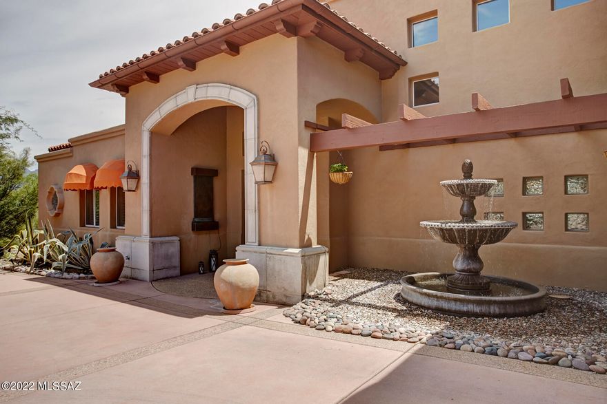 Outstanding  home with stunning views of mountains, Sabino Canyon and city lights in a gated community. On the main level primary bedroom  with fireplace, large walk-in closet with built-ins and garden tub, en-suite guest bedroom, formal living/dining room, spacious family room that opens to the Chef's kitchen. Upper level is a perfect retreat with loft and two bedrooms and bath. Deck off the loft offers outstanding mountain and city 
views. Beautifully landscaped backyard with patio, inviting pool & hot tub.