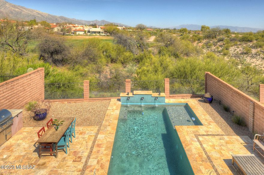 This luxurious single-family home is a true oasis, nestled in the picturesque Catalina Foothills of Tucson. Boasting over 3000 sqft of living space, this property offers the perfect balance of spaciousness and intimacy. With 4 bedrooms, 3 bathrooms, and a 2-car garage, this home is the ideal backdrop for all your family's special moments. The open floor plan creates an inviting atmosphere, with the living room, dining room, and kitchen flowing together seamlessly. The kitchen is a chef's delight, featuring gleaming granite countertops, a chic breakfast counter, and stainless steel appliances that will make cooking feel like a gourmet experience. The primary suite is a true retreat, with its spa-like bathroom, double walk-in closets, and breathtaking views of the surrounding mountains and La Paloma golf course.

The backyard of this property is a private paradise, with a sparkling saltwater pool beckoning you to cool off from the desert sun. As you float in the refreshing waters, you'll marvel at the stunning views of the mountains and La Paloma golf course, feeling grateful for this serene oasis you call home. Located in the highly coveted Catalina Foothills community, this home offers the perfect combination of luxurious amenities, stunning views, and a prime location. Top-rated schools, shopping, dining, and entertainment are just moments away, ensuring that you'll have everything you need to live your best life. Come experience the magic of this extraordinary property and make it yours today.