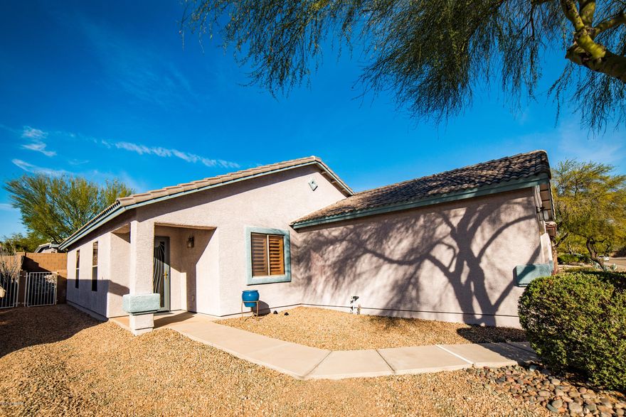 Gorgeous 1-owner home meticulously maintained inside and out. Brand new porcelain tile throughout, plantation shutters, newly planted Palo Verde trees in the back yard, custom brickwork landscaping in back and custom decorative security door.  Come see this exceptional home before it's gone!