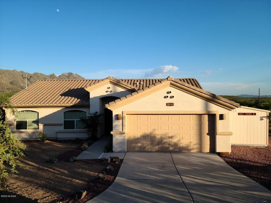 Wonderful home on 3 parcels. This home has been upgraded with many extras and cared for in such a good way. Beautiful front, side and back yards, top of the line Tuff shed attached and painted to match the home. A custom stone fireplace and BBQ in the backyard along with a full size greenhouse. Flagstone front and back as well. Also has a 16KW generator with 66.6 amps with a fully automatic transfer switch, 250 gal. propane gas. Home has a solar power system as well. All these amenities stay with the property. A must see!!!