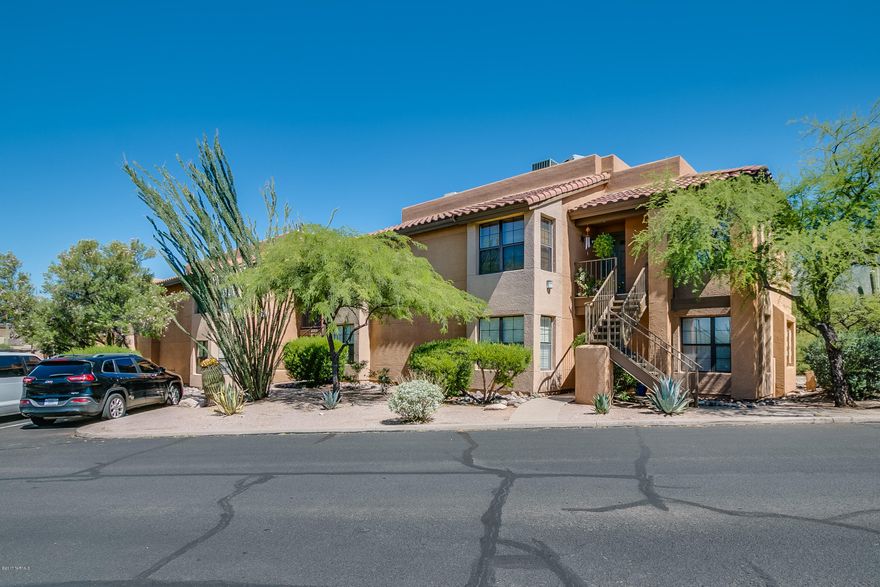 Resort style living in this impeccably upgraded professionally designed 2Bed/2Bath condominium at Skyline Village - just north of Campbell & Skyline. The unit is being sold as a fully furnished investment property as the furniture is available on a seperate bill of sale. Start making money immediately with the scheduled renters and seller will give buyer contacts for future renters. This condo does not disappoint with the impressive mountain views! Kitchen features included raised cherry wood cabinets, granite tile counters, porcelain tile floors & S/S appliances. Community pool, lighted tennis court plus exercise facility & roof, trash, pest & irrigation. Steps away from some of Tucson's finest shopping & dining. In the heart of the Foothills - straight shot to University and Downtown.