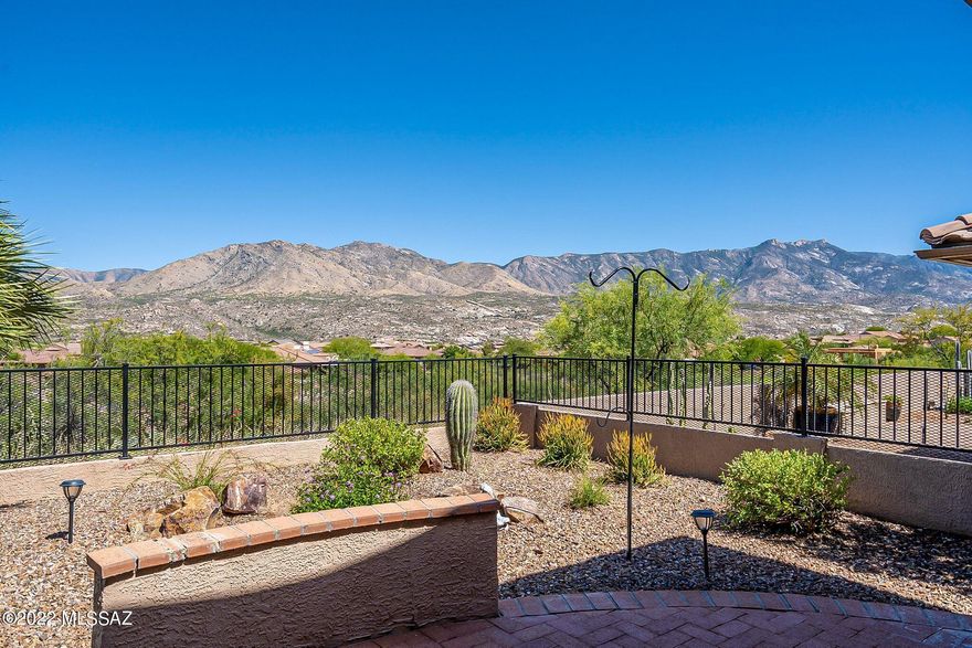 Enjoy fabulous panoramic mountain views from almost any room in the home!  This Ponderosa Model has open airy vaulted ceiling with beautiful wood kitchen cabinets, granite counter tops, Kitchen Aid appliances, a modern Blanco sink, wine cooler, beehive fireplace in the great room, updated bathrooms, solar tubes, neutral color tile and carpet flooring. the beautiful low maintenance landscaping has a newer irrigation system.  Owner owned solar system dramatically lowers electricity bills. Newer HVAC system, 2.5 car/golf course extended garage. air conditioned garage.  Full covered patio which is great for entertaining!  Make this fabulous home yours.  The garage is extended, extra lighting.