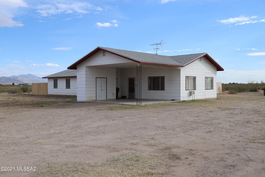 Ranch style House on 10 (10.93) acres offered in Willcox AZ. Near Tucson. 3 bedrooms,  2 baths.  Modern Kitchen, new floors. Great family room with fireplace. Family ready fenced in back yard. Horses welcome in fenced corral.  Enjoy country living while being 10 minutes to shopping, movies and schools. Have fun in the fall at You pick farms just 5 minutes from home. Willcox has an AVA (American Viticulture Area) with many wineries and vineyards. The area is known for its climate and soil and compared to wine grape areas of France and Italy. Willcox has festivals, parades and rodeos throughout the year. Willcox is a 1 hour drive to Tucson, Bisbee and Tombstone, AZ. Good schools, good climate and mountains. Hike, bike and camp nearby.