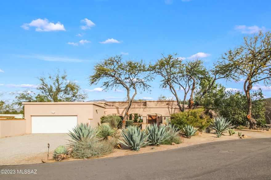 3 Bed 3 Bath PLUS Den/Office! Your opportunity to own in Tucson Country Club Estates and be part of history in the making. As you enter through the gated/guarded gate you instantly feel a sense of home. Mature trees line the streets, and a sense of community is felt passing by the joggers and golfers on their way to Tucson Country Club, a private invitation-only membership which boasts an exclusive 18-hole golf course, tennis courts, pickleball, fitness center, lap pool, splash pad, waterslide and clubhouse with monthly activities for the whole family. (Separate membership is required for TCC, apart from HOA) Split bedroom floorplan, Multiple patios and courtyards. Mountain views. Wood-burning fireplace. Storage opportunities abound in the garage cabinet space and laundry space. [more] Adjacent to nearby Rillito Riverwalk for long-range jogging, cycling and more. Imagine the possibilities of opening the kitchen to greet those gathering in the living area, or maintain the quaint privacy of a chef's kitchen within the existing design. Wine bar and built-in storage house all of your most precious flatware for entertaining. Primary bedroom has step-down office space with a wall of bookshelves and beautiful mountain views. Dual closets provide ample space. Primary bathroom has soaking tub and spa-like shower. Executive height counters boast two sinks and additional vanity space. Solid wood doors throughout, and gallery lighting to show off your favorite photos and art collections. Magical moments live in the nooks of the windows with sills around the corners of the hallways. A private patio off the hallway near the other two bedrooms provides yet another sanctuary to enjoy coffee or tea and watch the birds. Spacious bedrooms have windows with built-in blinds, to elevate the lifestyle of less dusting, more stargazing. Landscaping is lush and inviting, with mature trees for shade and character. Pool-sized yard for possible future development should the desire arise. Lovingly maintained, this home is preparing for its next honorable owner. Buyer to verify all facts + figures, including those in MLS.