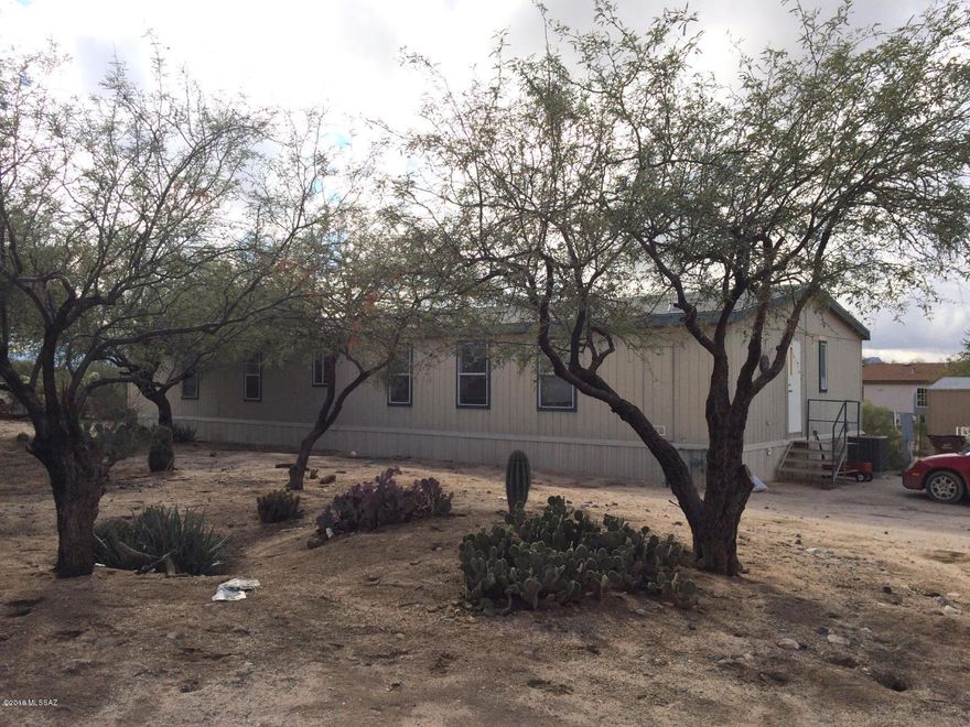 Two manufactured homes on 1.14 acre horse property. One home has 3 bedrooms, 3 baths, 1848 sq. ft., split bedroom plan, formal living/dining room with fireplace in living room. Built in 2001. Awnings are on both front & back.  Block skirting. 2nd manufactured home is not affixed, 5 bedrooms, 3 full baths, and approx. 2007 sq. ft., built in 2003. 
Two septic tanks. Shared well.
